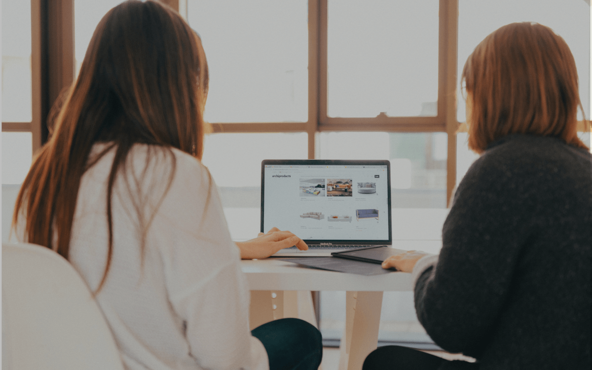 woman consulting another woman on marketing